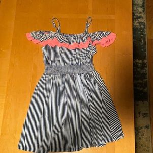 White dress with blue stripes and blue white and pink ruffle